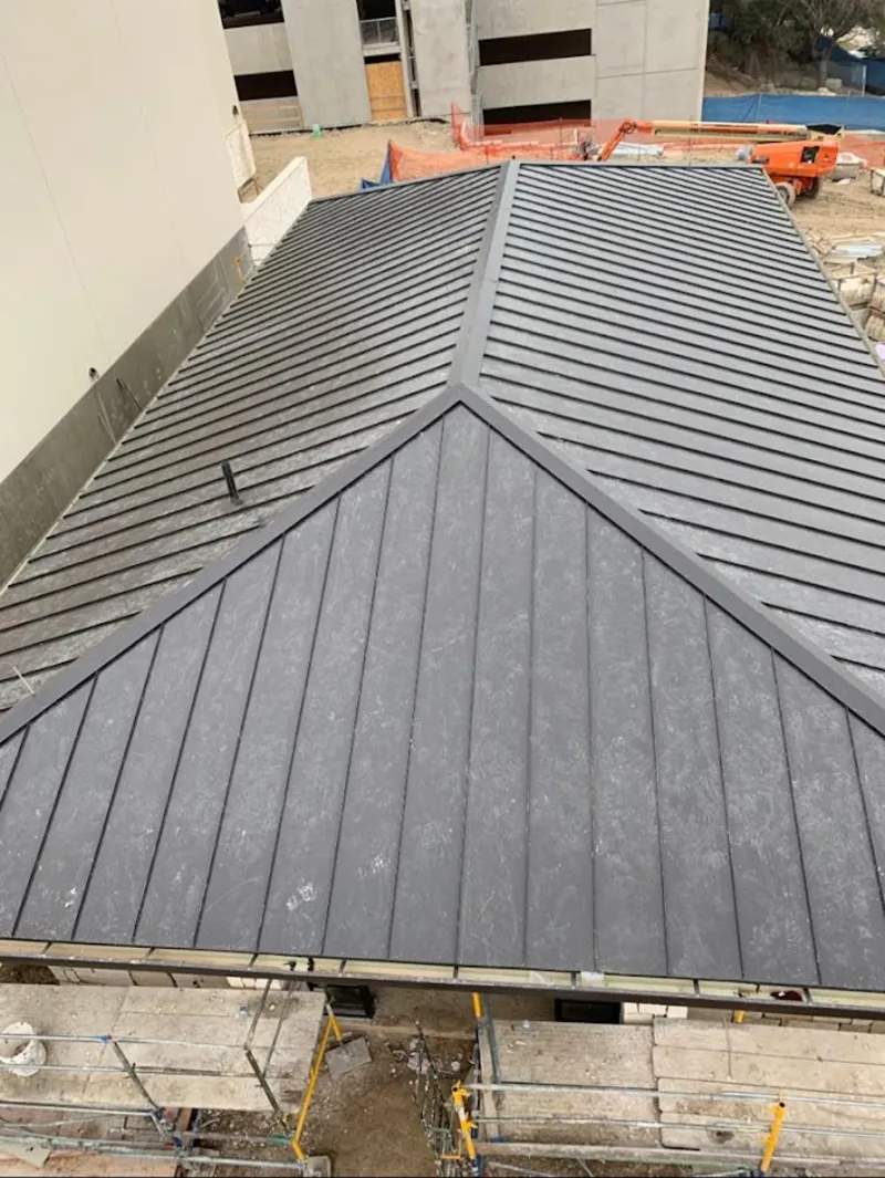 Commercial metal roof construction with crane equipment in Lemon Hill