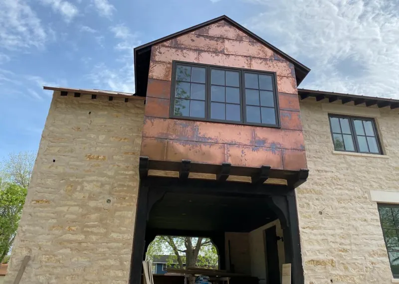 Copper metal panel facade on a stone building for Skylight Installation in Lemon Hill